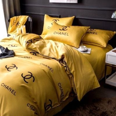 Chanel Logo in Yellow Background Bedding Set Diverse Design and Materials